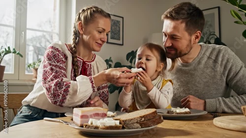 Family having breakfast together in a cozy dining room