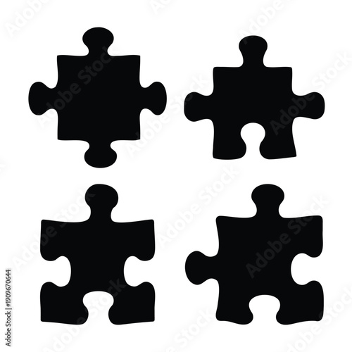 Four black puzzle pieces isolated on a white background, representing connection and solution