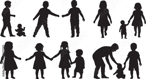 Silhouettes of happy family and children playing together outdoors