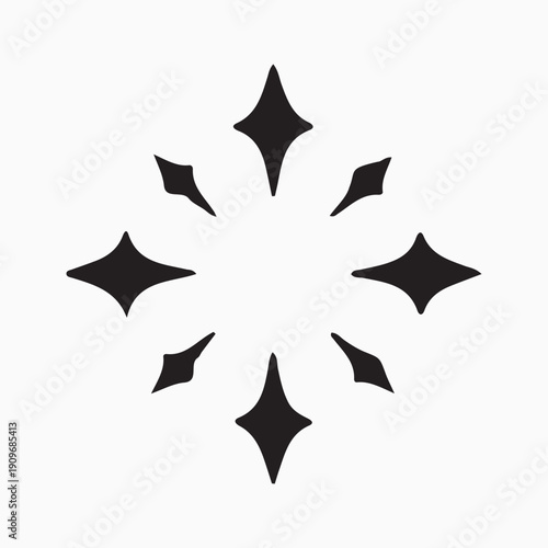 A stylized black star shape on a white background with symmetrical elements.