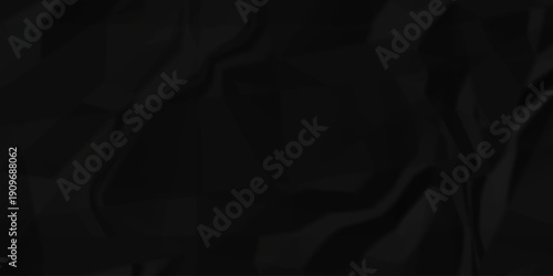 Crumple crushed black paper obsolete rumple craft design. wrinkle ripped creased crumple aged closeup recycled document grunge paper background.