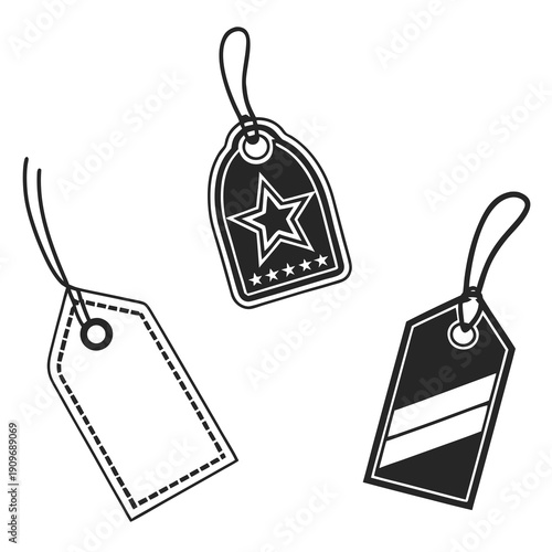 Assorted black and white tags with unique designs and string attachments.