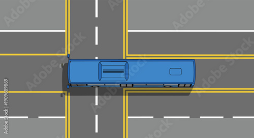 Top-down aerial view of a blue bus driving through a four-way road intersection with clear lane markings for traffic.