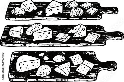 Cheese and crackers on wooden serving boards with nuts and bread snacks