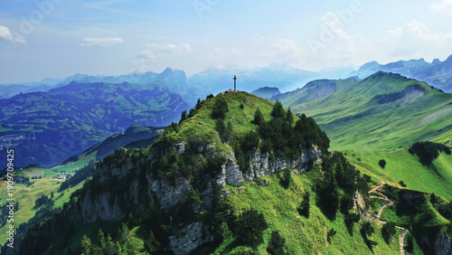 Obraz na plátně Aerial panoramic view of the Fronalpstock summit cross and the famous ridge hiki