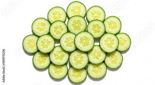 Fresh sliced cucumbers arranged in a pile on white