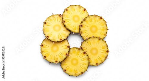 Fresh sliced pineapples arranged in a circle on white
