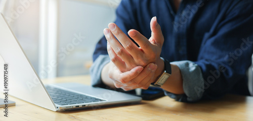 Tablou pe pânză close up employee man massage on his hand and arm for relief pain from hard work