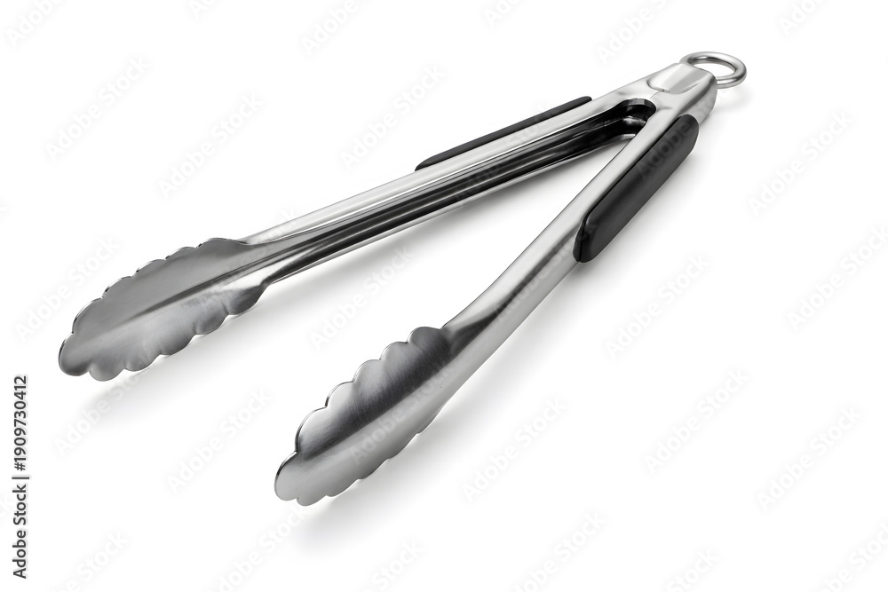 Fototapeta premium Stainless steel kitchen tongs with black rubber grip and locking mechanism