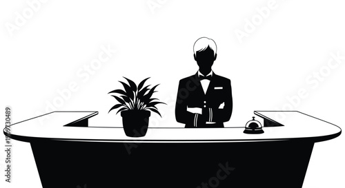 Silhouette of a man in a tuxedo standing behind a reception desk with a plant