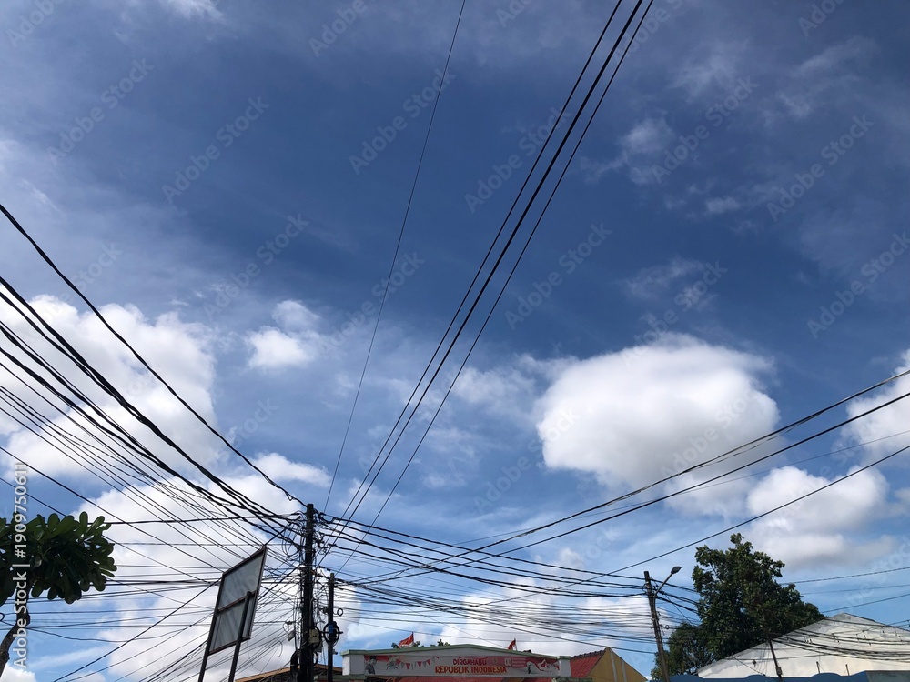 Fototapeta premium high voltage power lines against blue sky