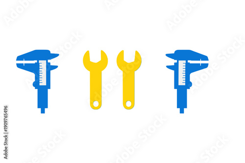 Tools for measuring and fixing are set on a plain background during a workshop session in a garage or studio