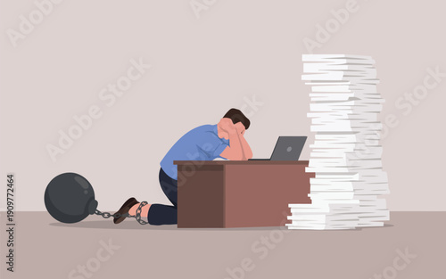An exhausted businessman kneels with a ball and chain, overwhelmed by a towering stack of papers