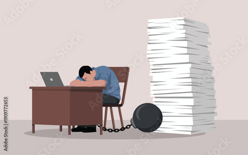 An exhausted office worker is held captive by a heavy chain while slumped over his desk with many papers