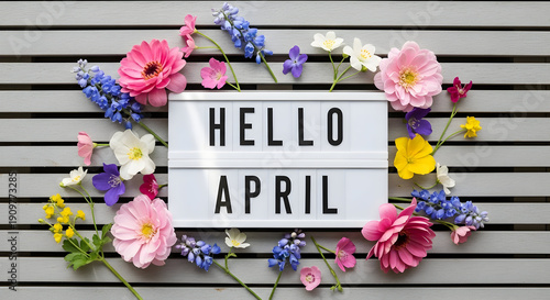 April fools day greeting with colorful flowers and hello april sign