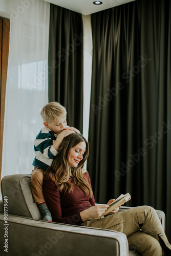 Mother and son enjoy readin...