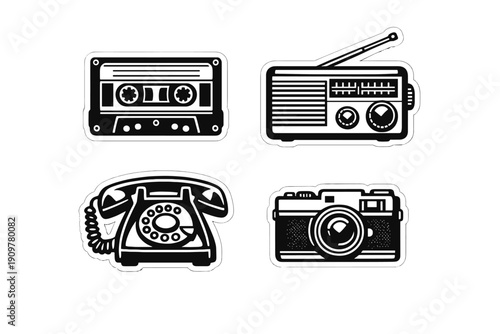 A collection of four black and white vintage technology stickers featuring a cassette tape, a portable radio, a rotary dial telephone, and a classic camera on a dark background.