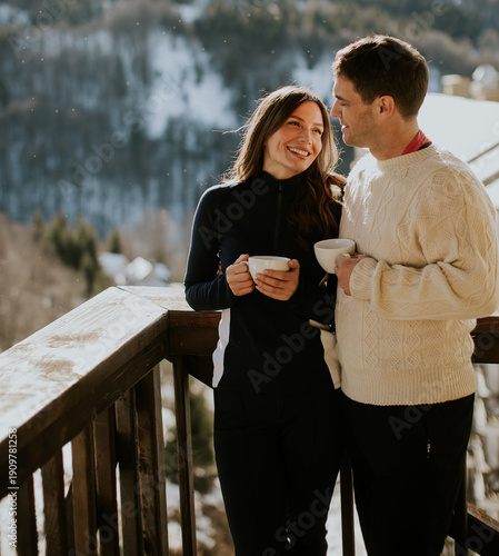 Couple enjoys warm drinks o...