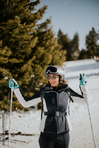 Woman enjoys skiing with sk...