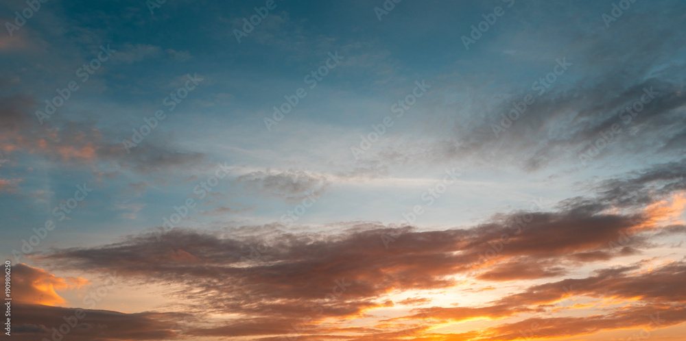 Fototapeta premium Beautiful colorful sunset with orange clouds. Sky background.