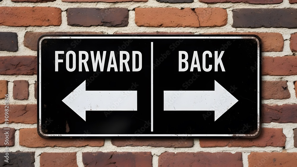 Obraz premium showing direction sign with forward and back arrows on brick wall background