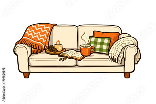 A cozy white sofa is decorated with an orange chevron blanket, a green checkered pillow, and a chunky knit throw. A lit candle, an open book, and a steaming mug sit on the cushions.