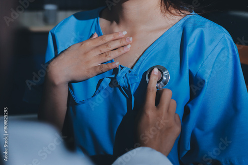 healthy concept; Doctor checking patient's heart with stethoscope at a hospital