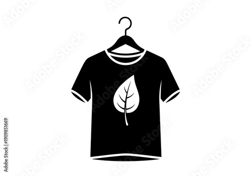 A simple but fine black tshirt icon with white leaf graphic on hanger eco friendly fashion concept