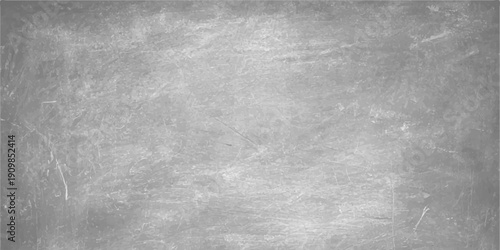 A dark aged metal surface with a rough grunge texture features a vintage gray concrete pattern and dirty black paint on an old weathered wall backdrop