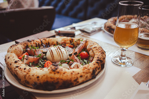 Rich Italian pizza on the restaurant table
