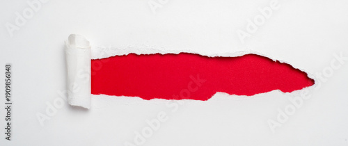 Wallpaper Mural White paper with a portion torn away, revealing a bright red background texture underneath. Torontodigital.ca