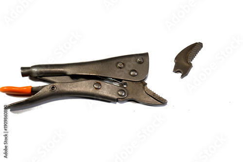 broken Locking jaw pliers known as Vise-Grips or mole wrenches, versatile, adjustable hand tools featuring a locking mechanism that clamps onto objects with high pressure