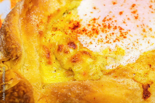 Wallpaper Mural Close-up of delicious khachapuri with melted cheese and a fried egg on top Torontodigital.ca