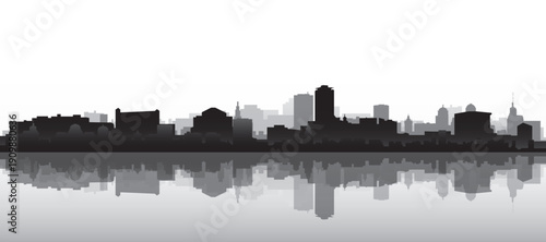 Black and white panoramic poster of the city skyline with misty background buildings and water reflection of DUBLIN, IRELAND