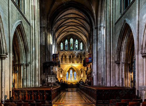 Central nave of St Patrick's Cathedral featuring soaring Gothic arches, stained glass and medieval atmosphere, heart of Ireland’s largest cathedral, Dublin, Ireland.