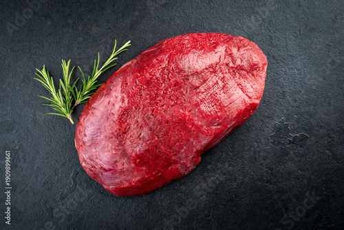Canvastavla Boneless venison haunch - top round steak raw offered as top view on slate plate