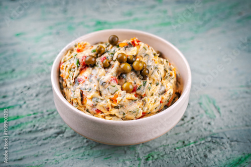 Artisan sun-dried tomato butter -compound butter spread with fresh herbs, dry  tomatos, green pepper and wild garlic