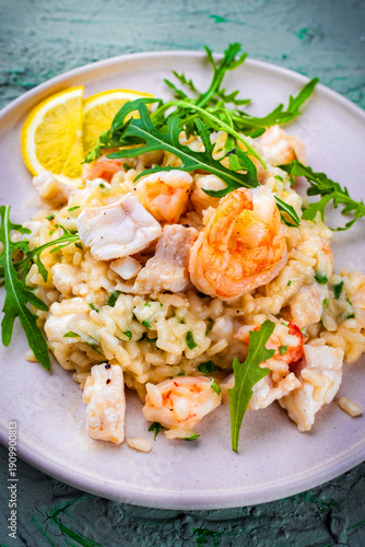 Obraz na plátně Risotto ai frutti di mare -  classic seafood risotto with fish and scampi prawns