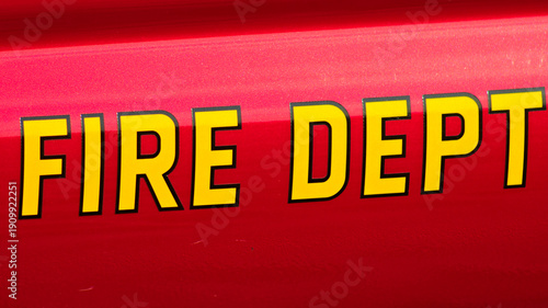 Foto Close up of bold yellow Fire Dept lettering on red emergency vehicle used by Los Angeles County responders
