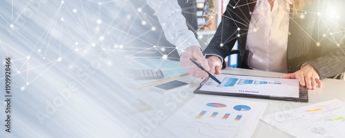 Business people talking about business performance; panoramic banner