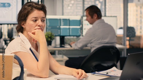 Tableau sur toile Frustrated businesswoman tearing and crumpling paper after writing mistake at desk