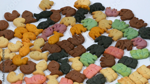 Colorful salty biscuits in the shape of small elephants isolated on a white background. The concept of delicious and sweet biscuits.