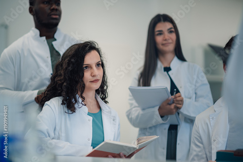 Obraz na płótnie Diverse students learning in a scientific lecture