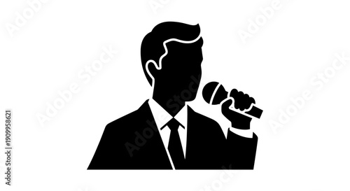 Man in suit holding microphone.