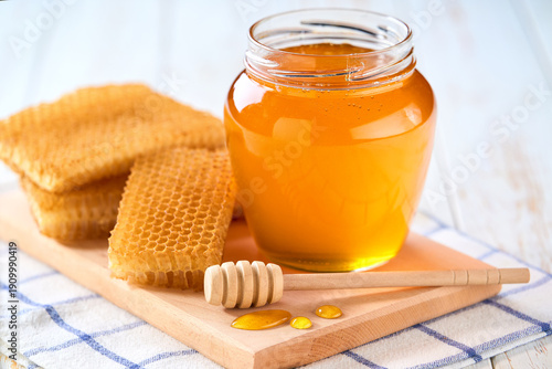 Wallpaper Mural nature honey in a jar on a white wooden table, selective focus. Torontodigital.ca