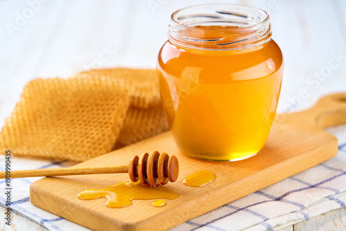 Wallpaper Mural jar of nature honey on light kitchen table, selective focus. Jar of sweet honey . Torontodigital.ca