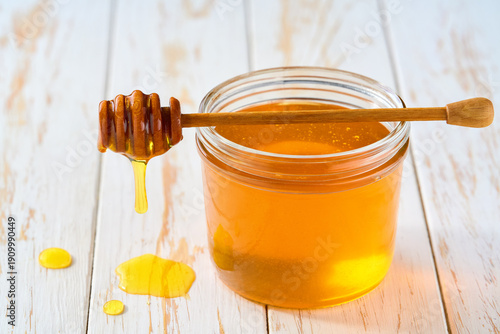 Wallpaper Mural nature honey in a jar on a white wooden table, selective focus. Torontodigital.ca