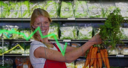Grocery worker extending arm, holding carrots forward, promoting produce, overlay crossing front