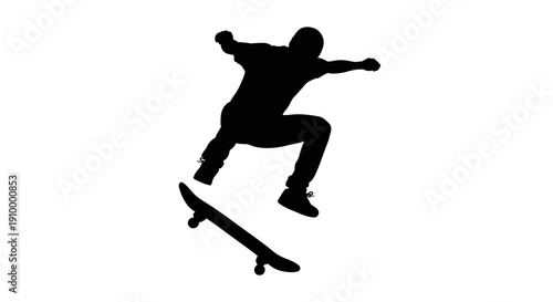 Skateboarder in mid air silhouette.
