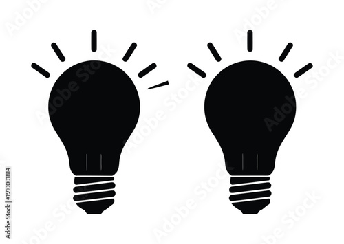 Two illuminated black light bulbs on white background